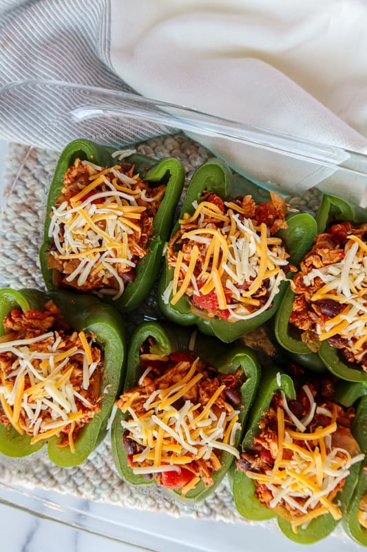 Mexican stuffed peppers covered in cheese.