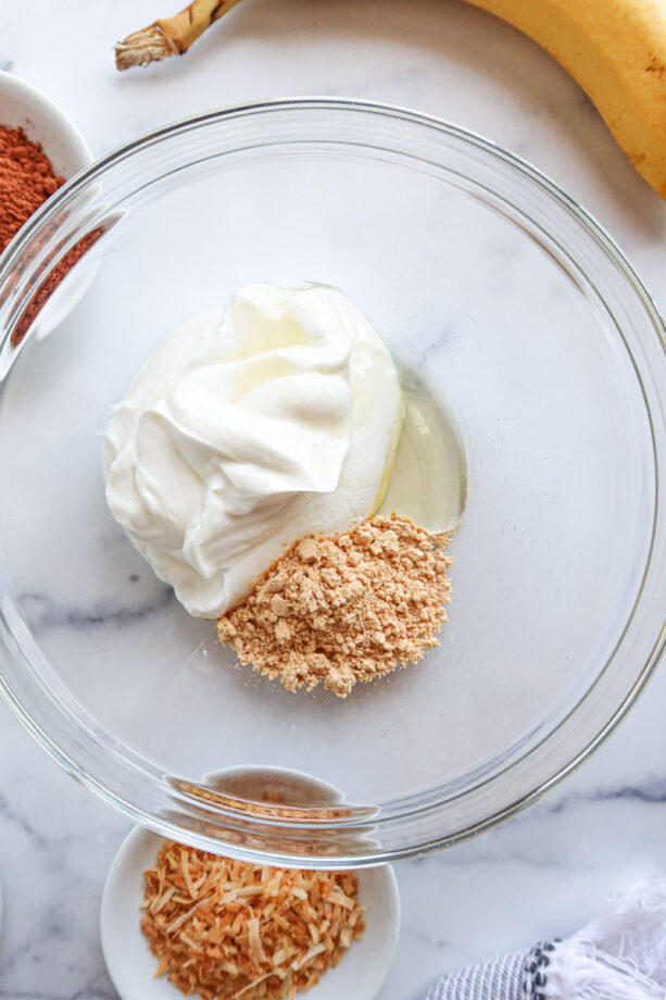 Yogurt, agave and peanut butter powdered in a mixing bowl. 