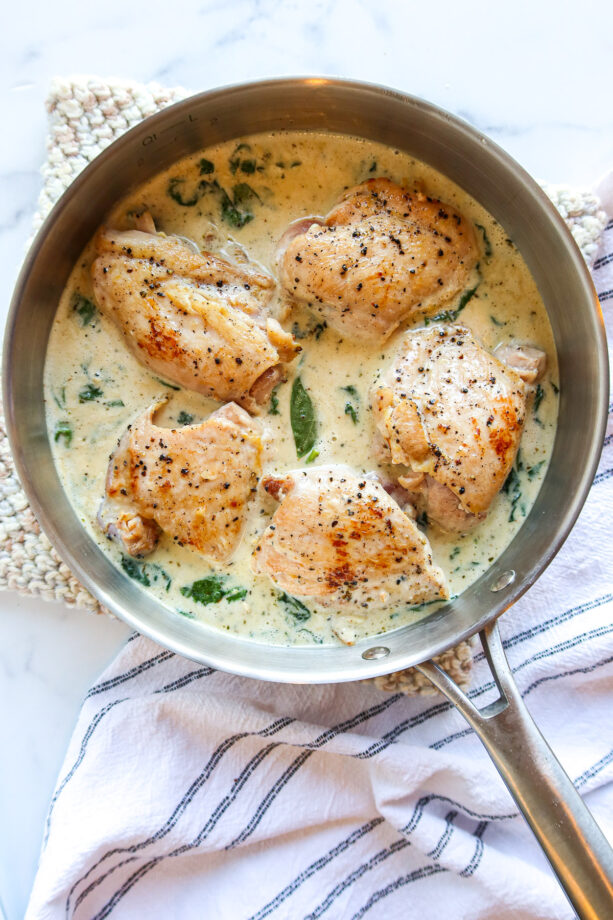 Pan seared boneless, skinless chicken thighs in creamy spinach sauce.