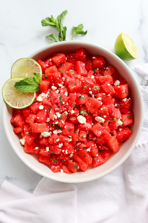 Watermelon mint and feta salad in a white serving dish.