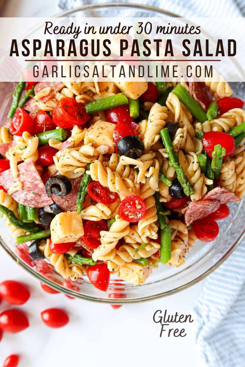 Pasta salad in a glass bowl with text overlay for Pinterest.