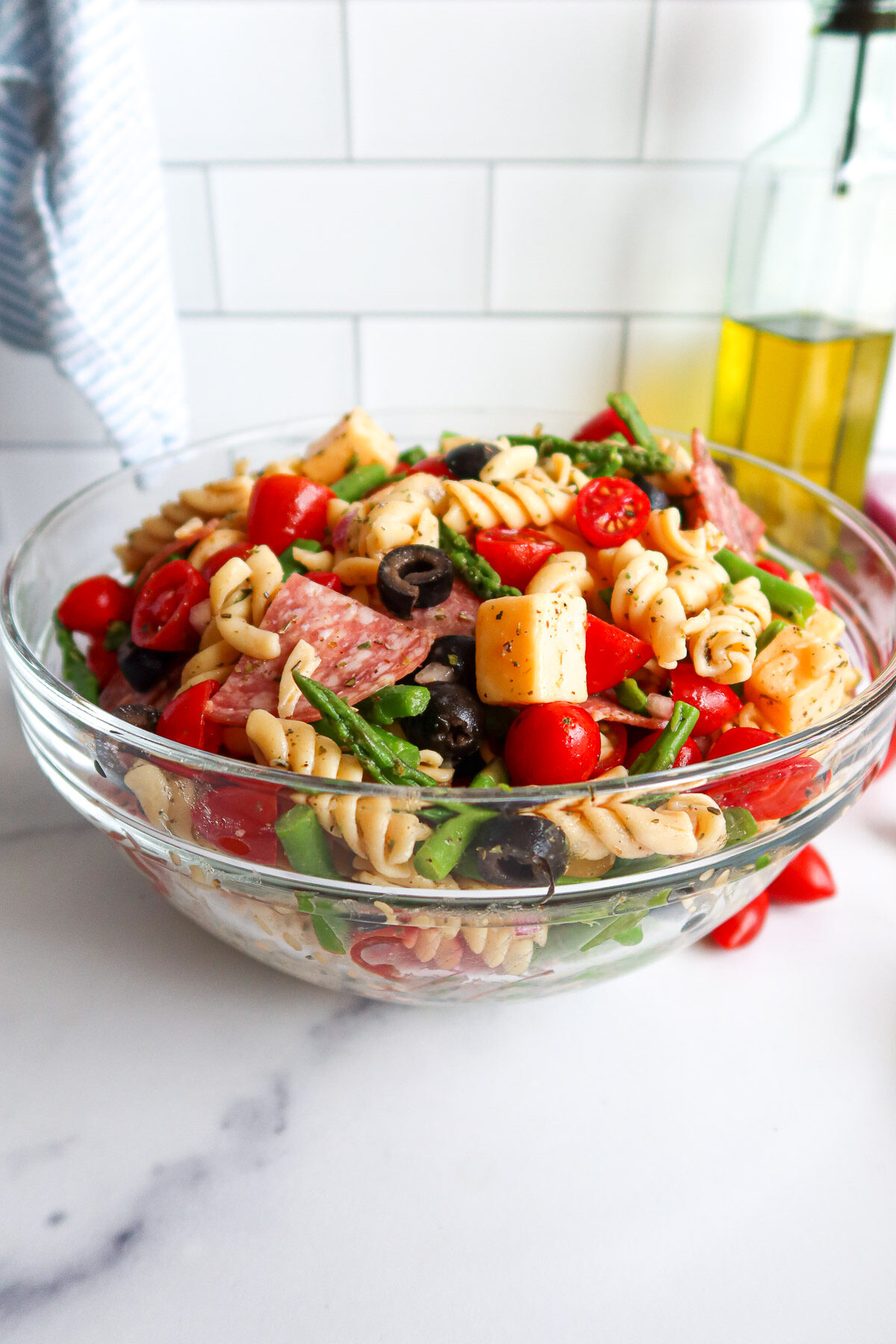 Pasta salad in a glass bowl.