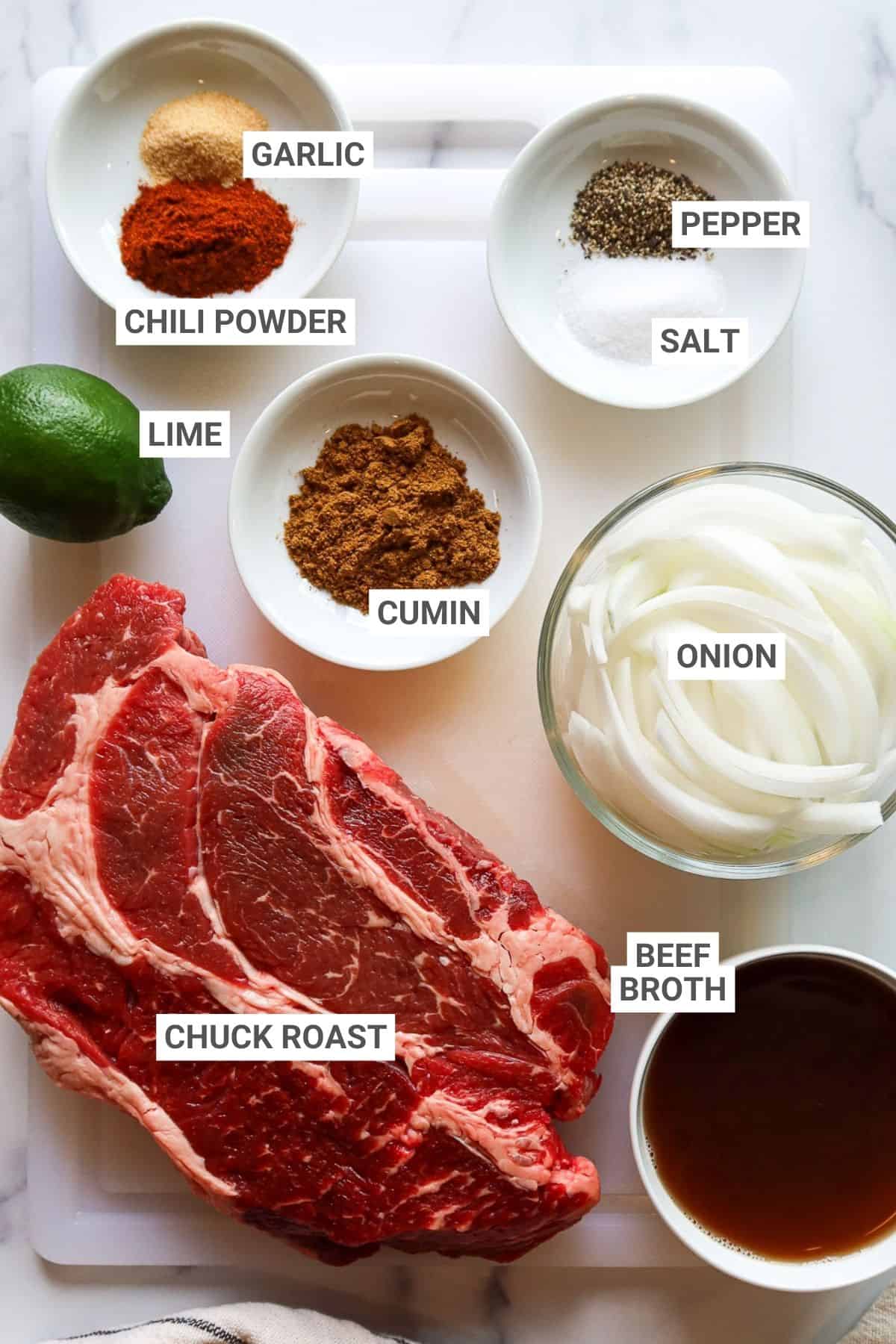 Ingredients for slow cooker Mexican shredded beef with text overlay labels.