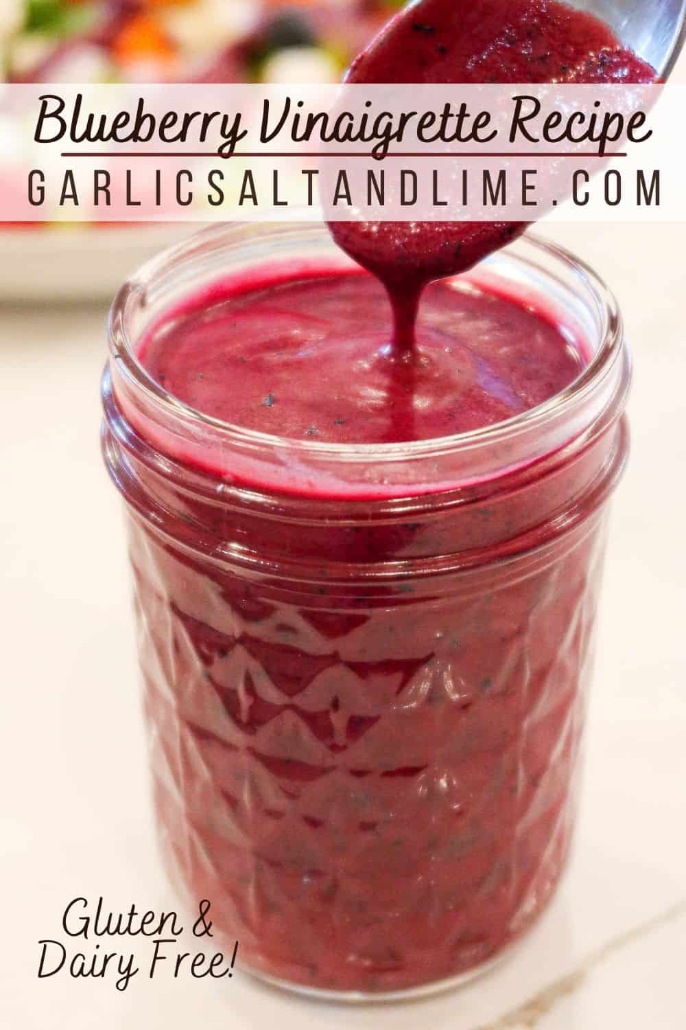 Blueberry dressing in a glass jar with text overlay for Pinterest.