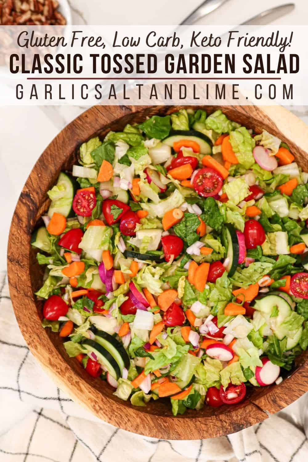 Garden salad in a wooden serving bowl with text overlay for Pinterest.