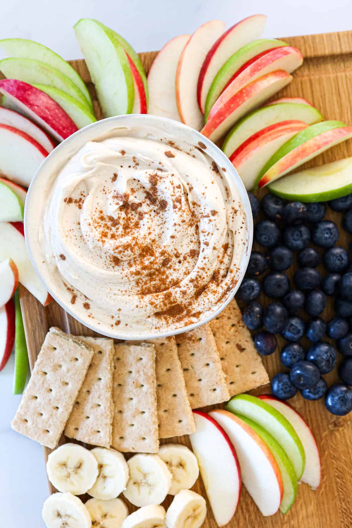 Peanut butter yogurt dip with fruit and graham crackers.
