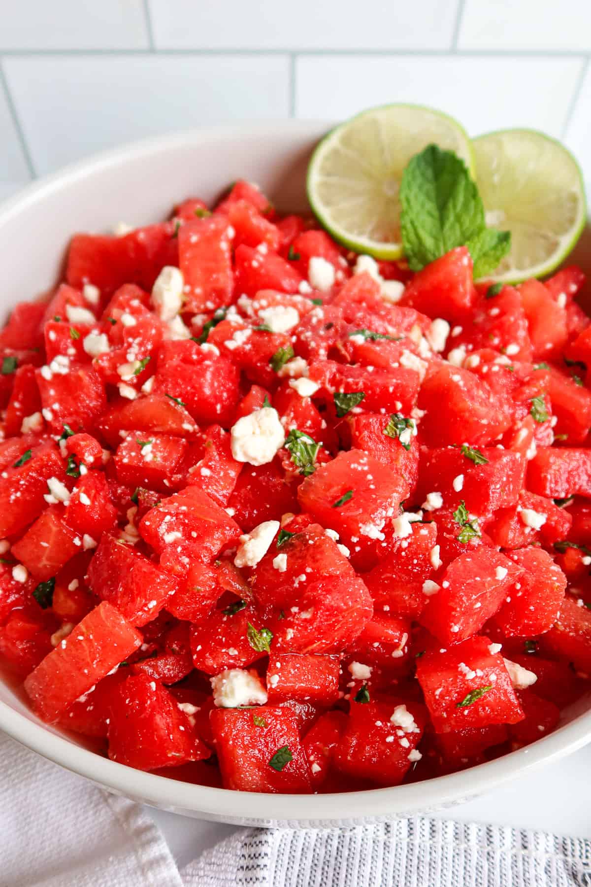 Watermelon mint feta salad in a white serving dish.