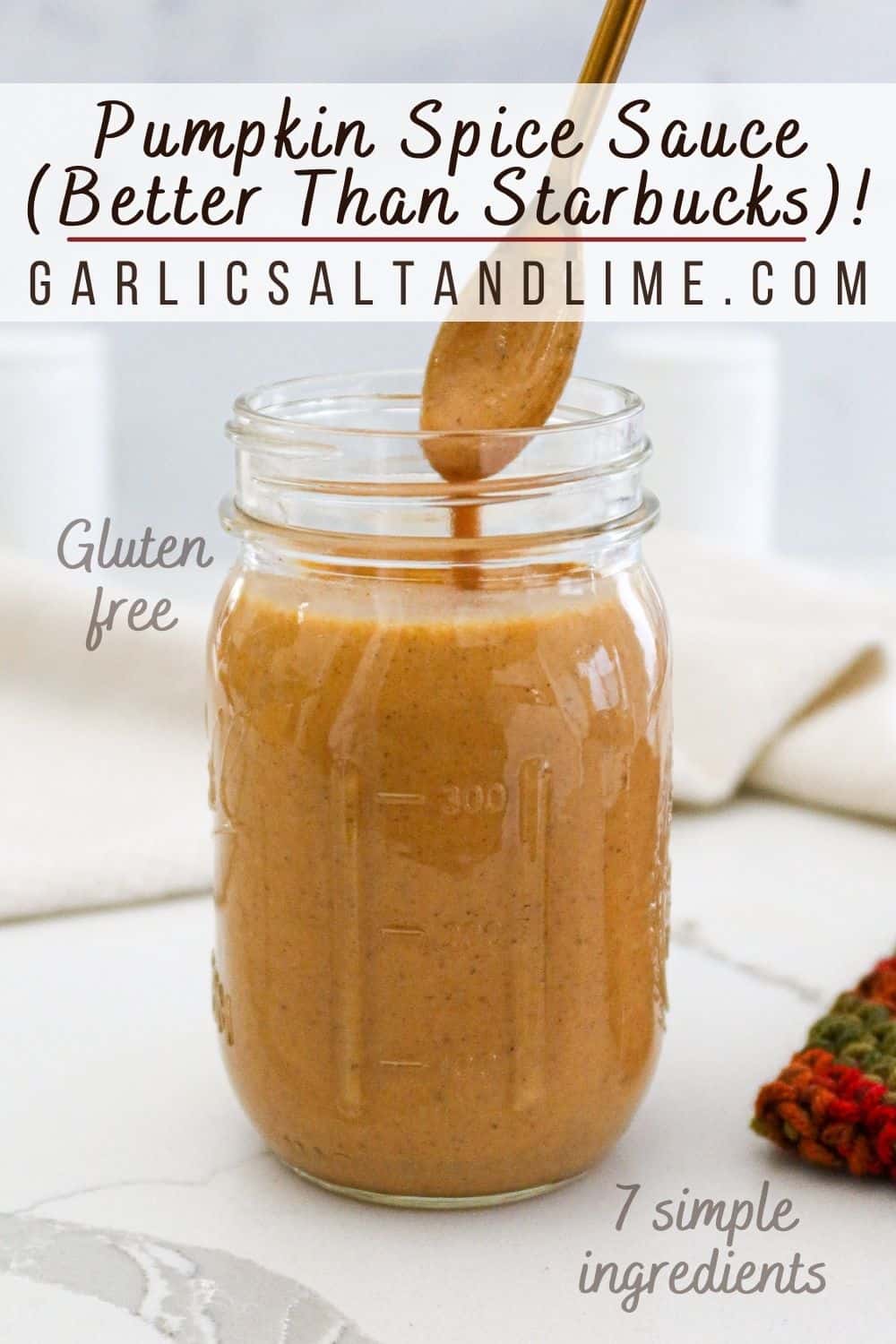 Pumpkin spice sauce in a mason jar with text overlay for Pinterest.
