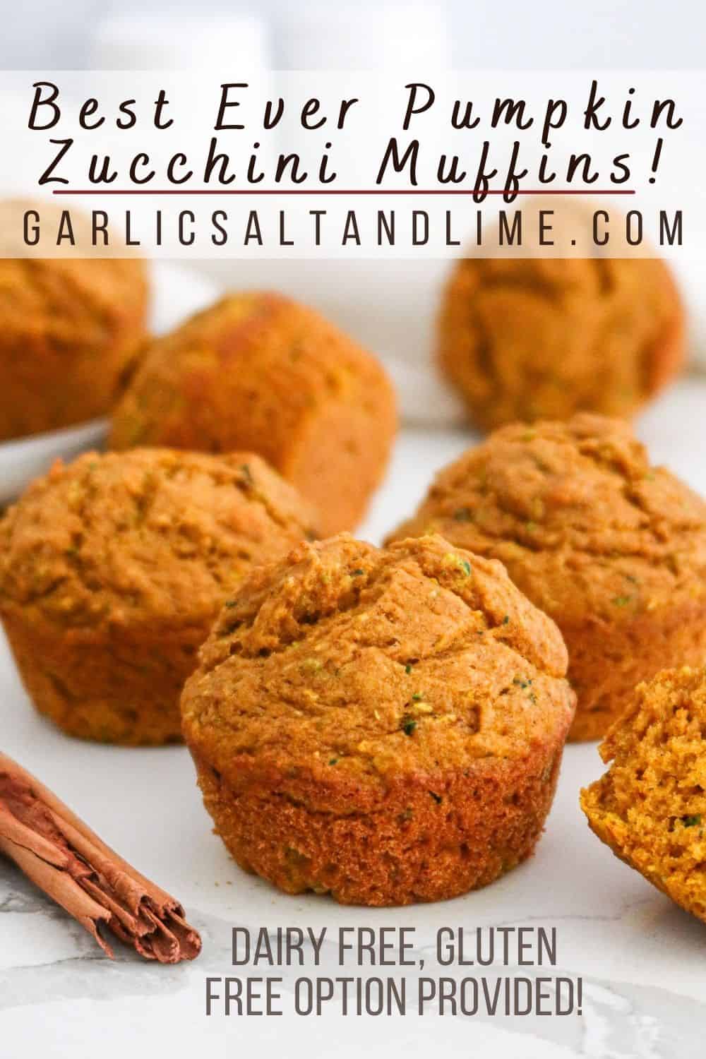 Pumpkin zucchini muffins sitting on a white countertop with text overlay for Pinterest.