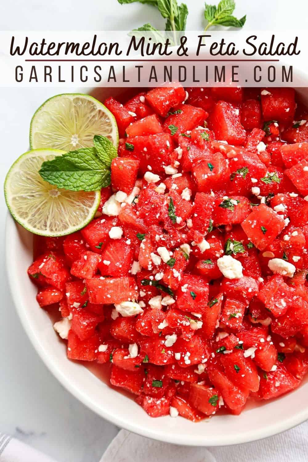 Watermelon mint feta salad in a white serving dish with text overlay for Pinterest.