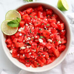 Watermelon mint feta salad in a white serving dish.