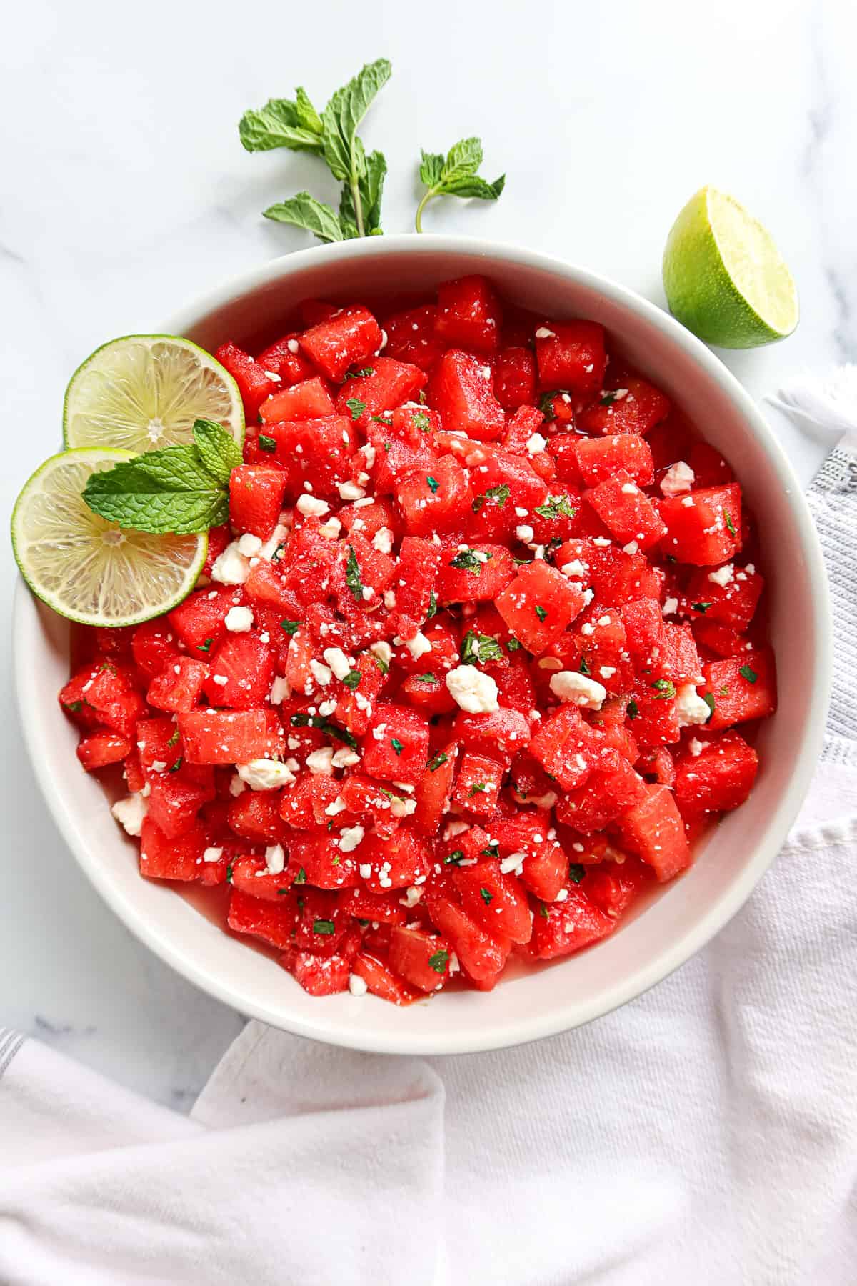 Watermelon mint feta salad in a white serving dish.