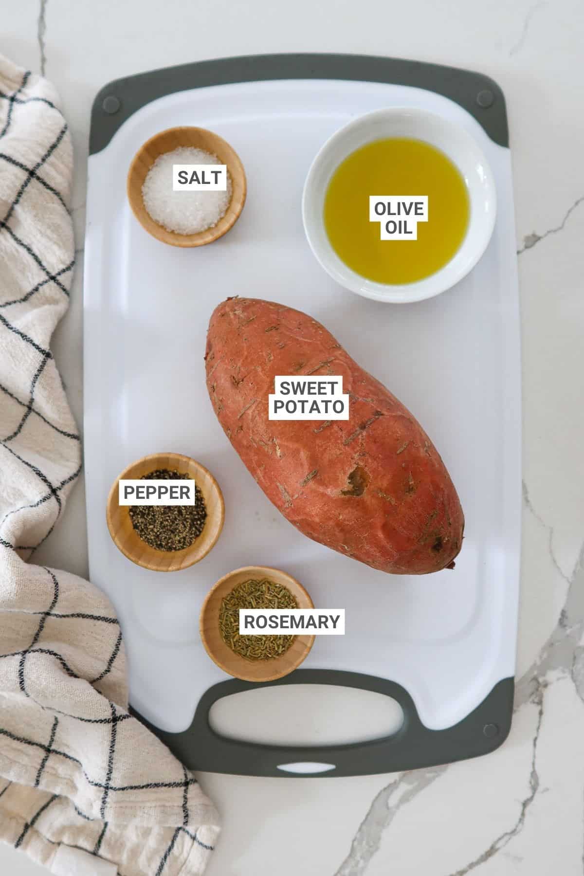 Ingredients for air fryer sweet potato cubes arranged on cutting board with text overlay labels.