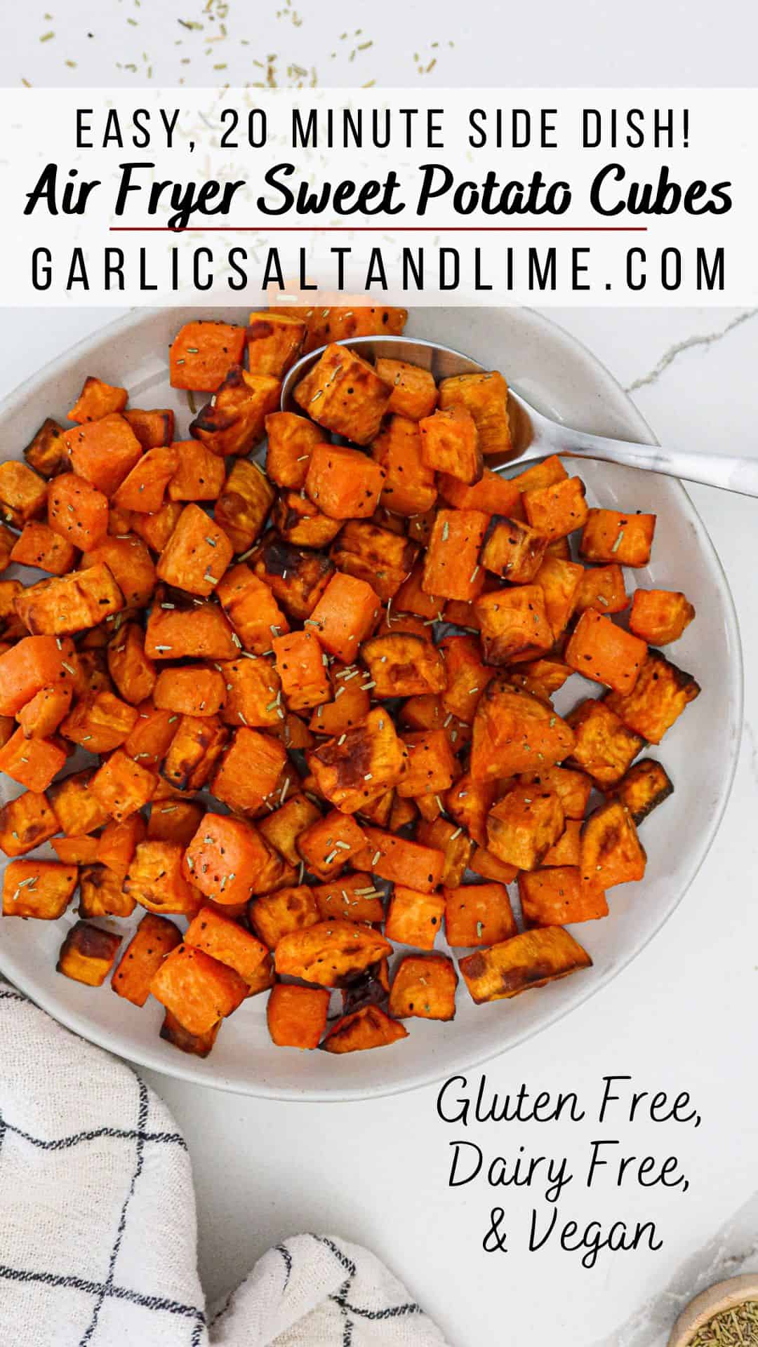 Air fryer sweet potato cubes in a serving bowl with text overlay for Pinterest.