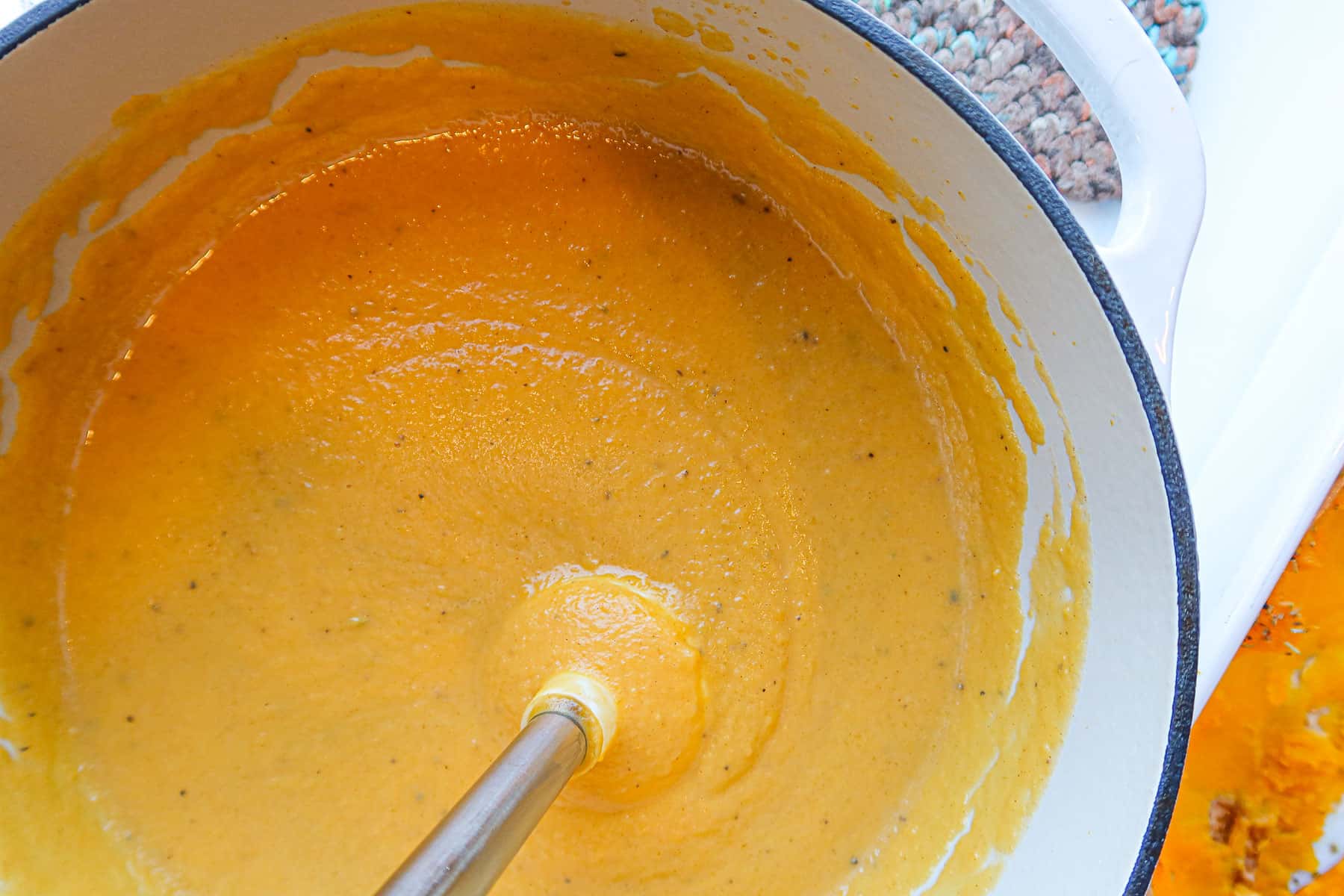 Pureeing butternut squash soup with coconut milk.