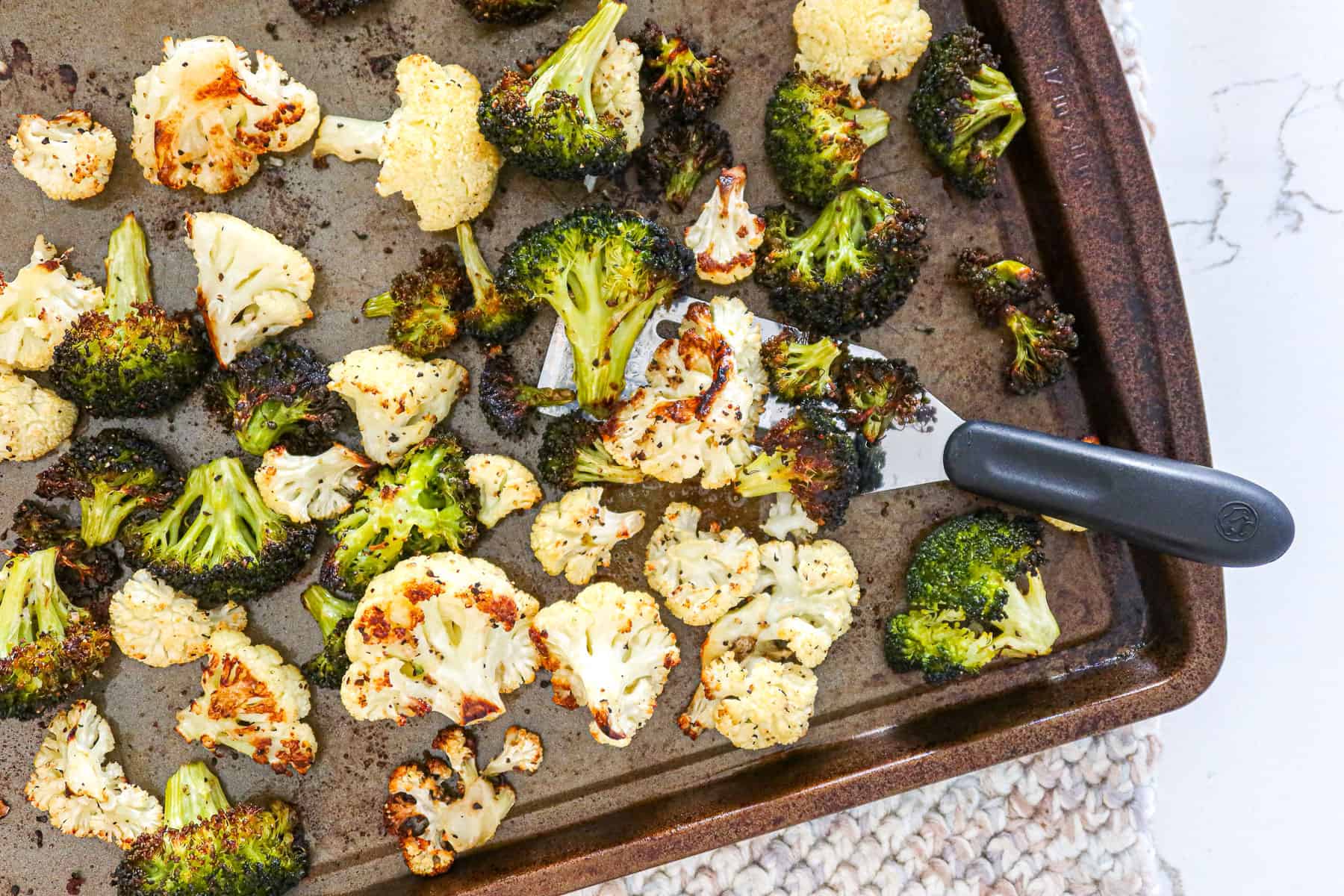 Roasted florets on baking sheet.