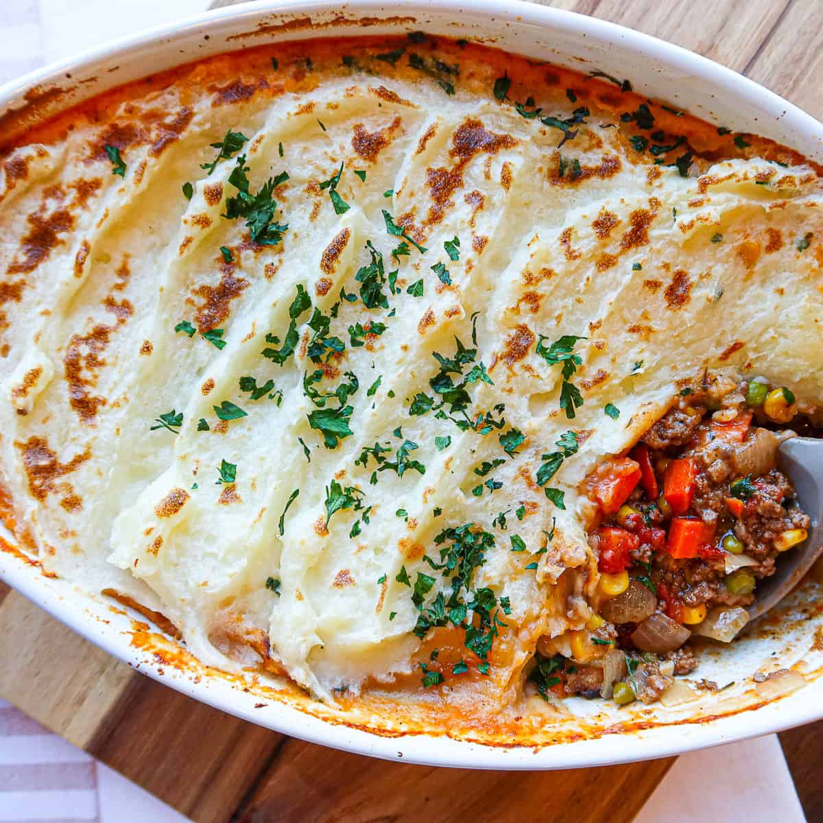 Homemade shepherd's pie in a white baking dish.