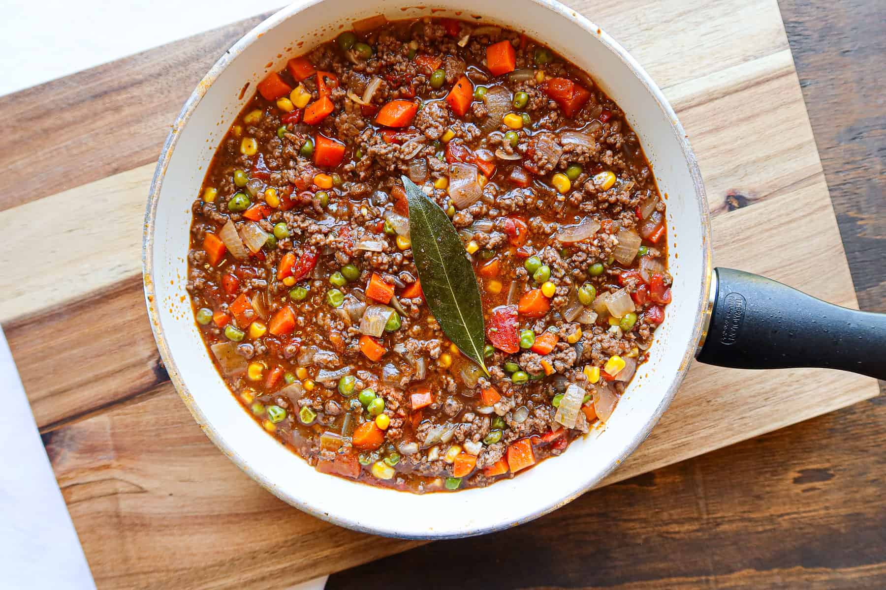 Shepherd's pie filling in a white skillet.