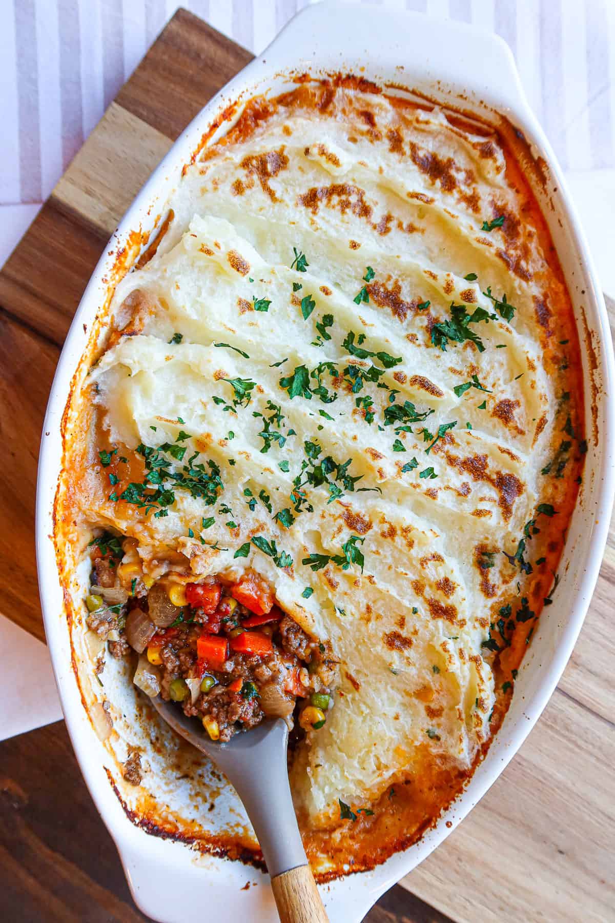 Ground turkey shepherd's pie in a white baking dish.