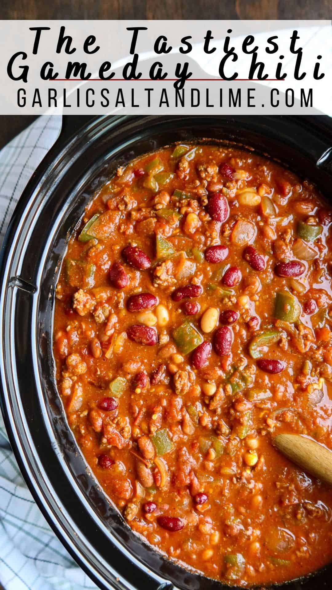 Chili in a black crockpot with text overlay for Pinterest.