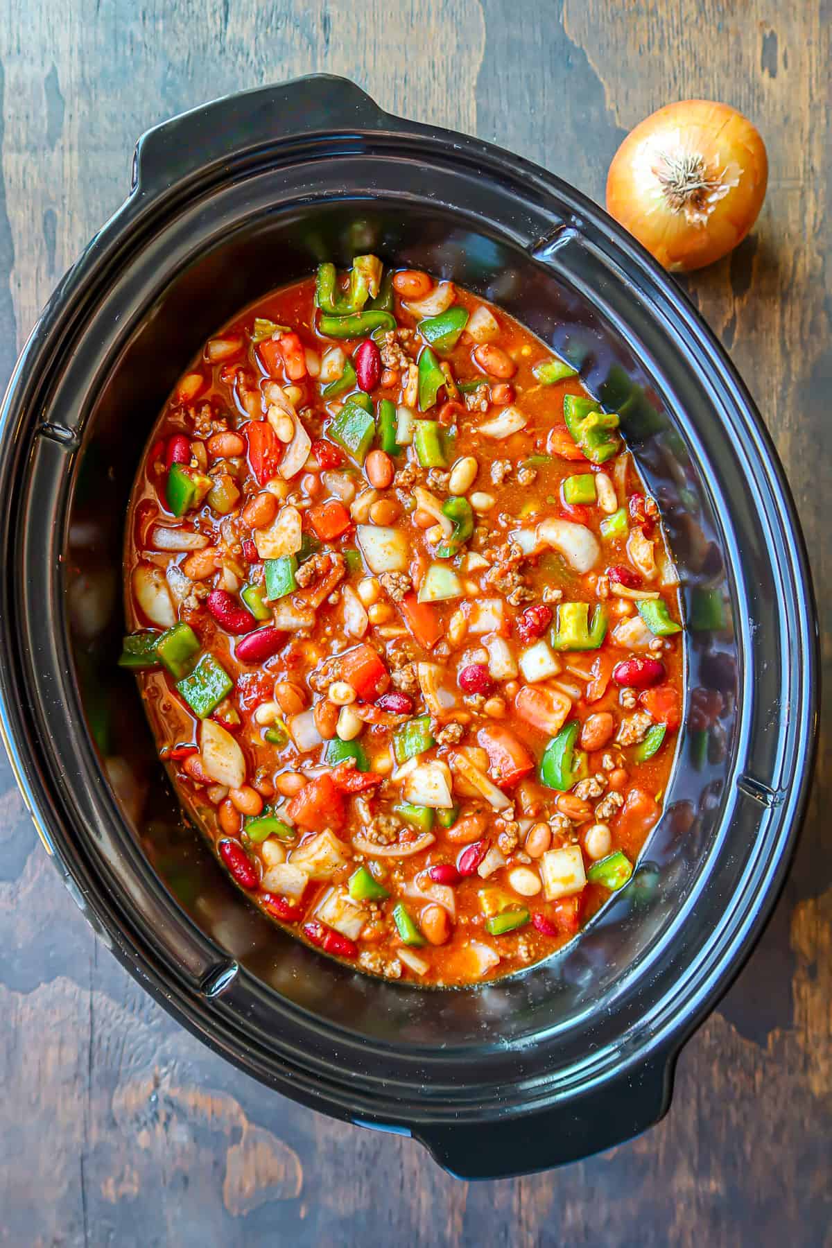 Chili ingredients mixed together in a large crockpot.