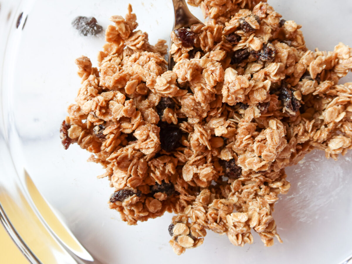 No bake oatmeal raisin cookies batter in a mixing bowl.