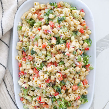 Ditalini pasta salad in a white serving dish.