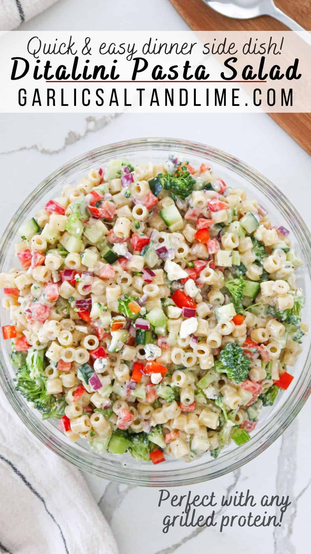 Ditalini pasta salad in a glass bowl with text overlay for Pinterest.