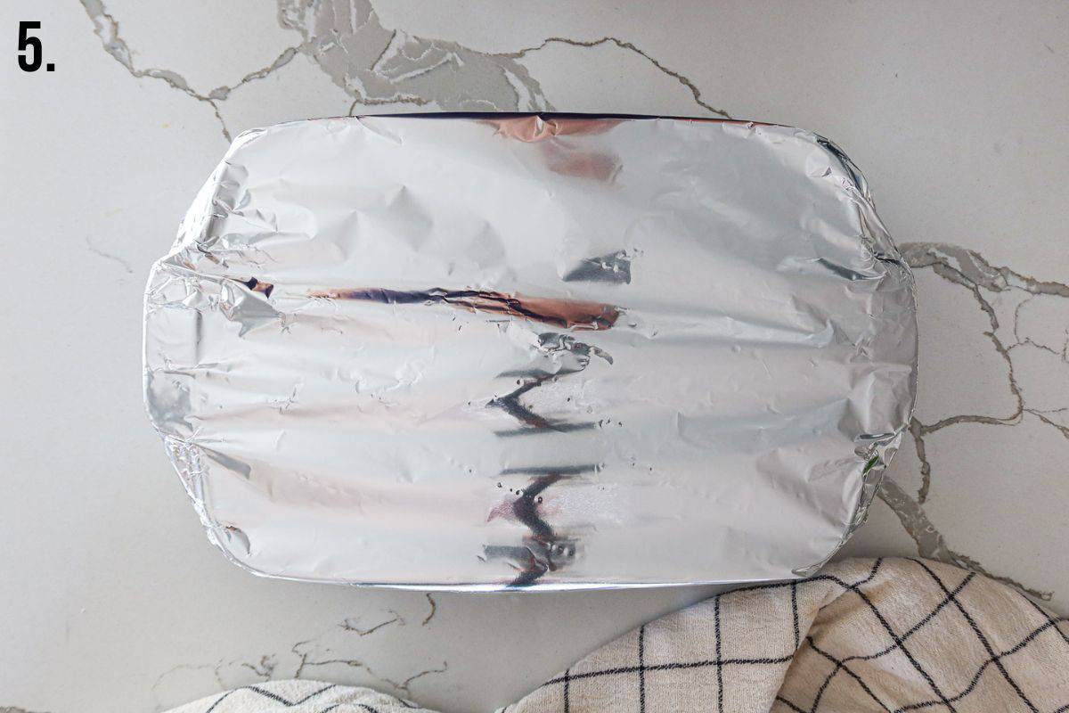 Baking dish covered in aluminum foil.