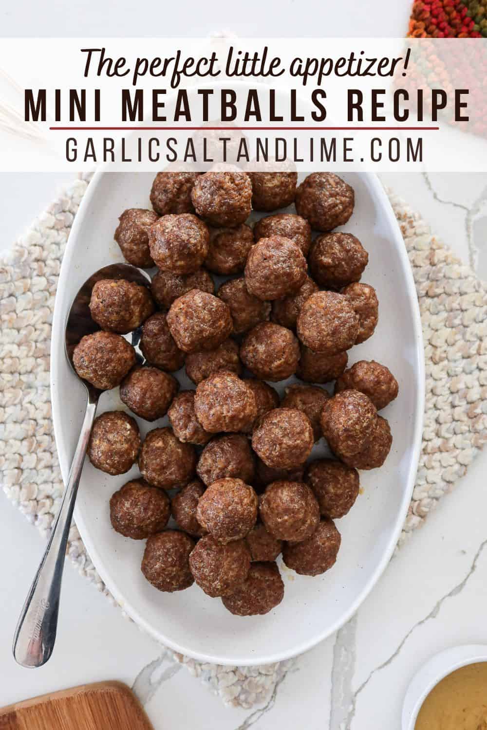 An overhead view of mini meatballs with text overlay for Pinterest. 