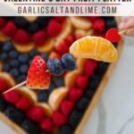 Valentine's day fruit platter with text overlay for Pinterest.