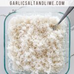 Oven baked rice with text overlay for Pinterest.