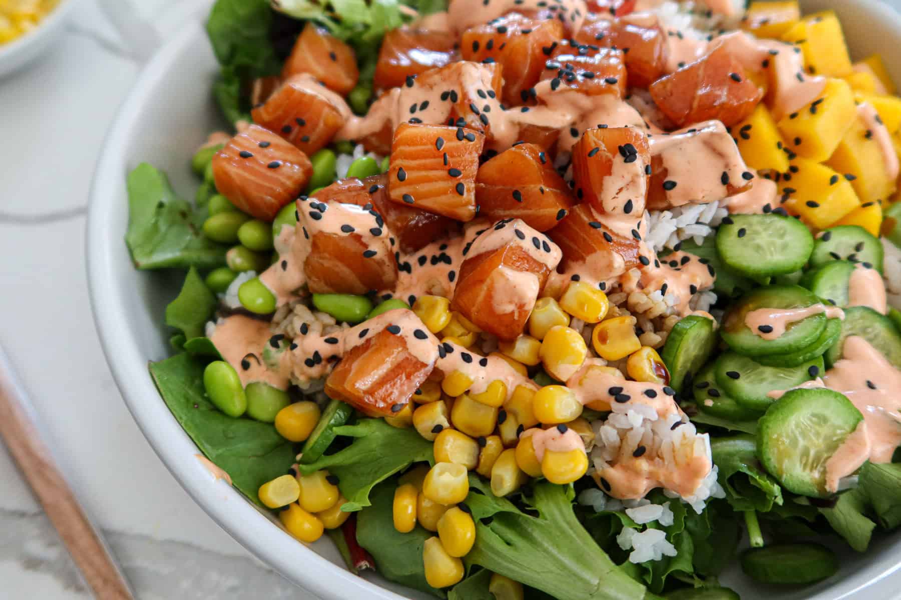 Salmon poke bowl close up.