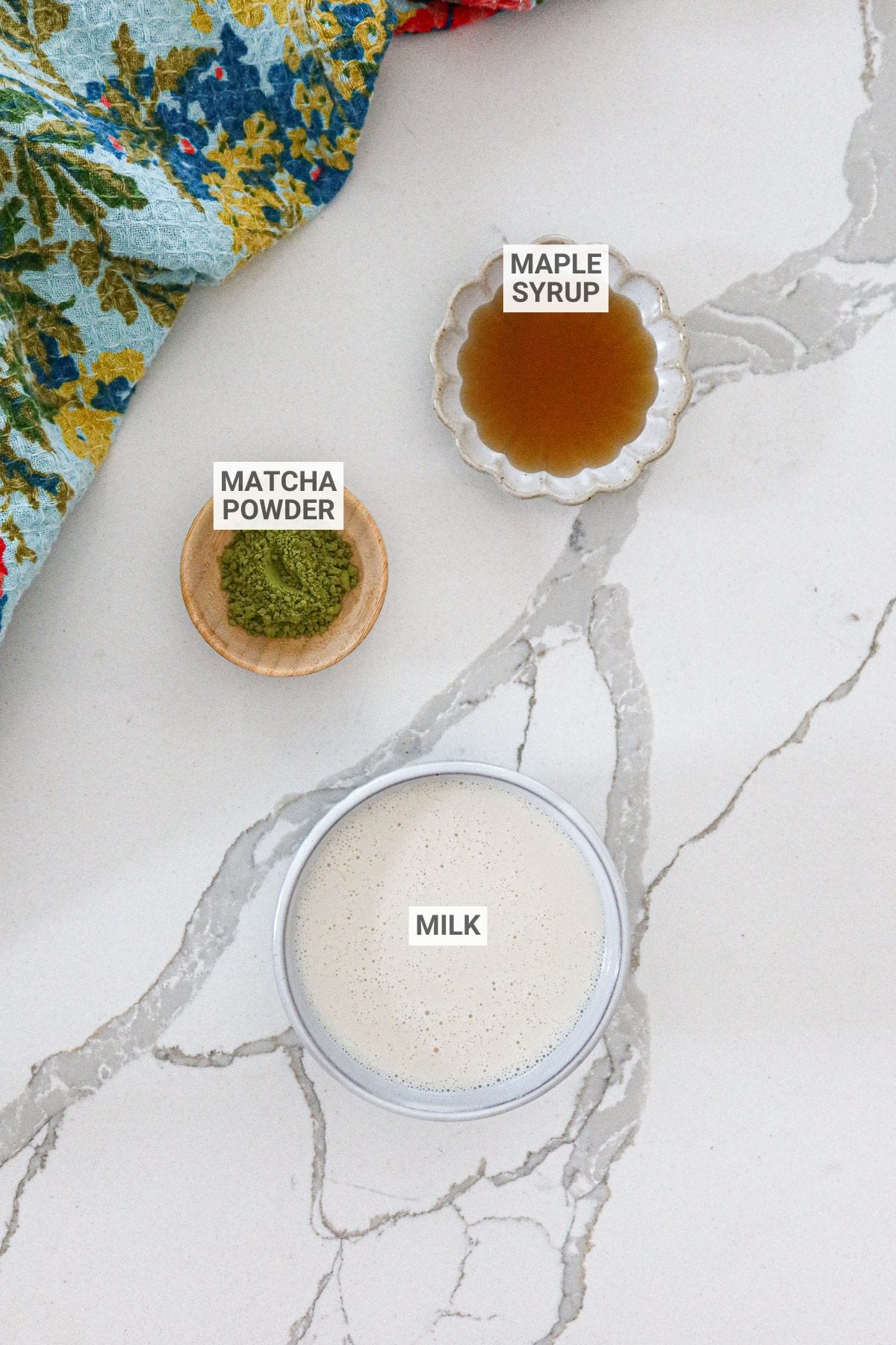 Iced matcha latte ingredients with text overlay labels.