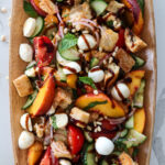 Peach panzanella salad closeup.