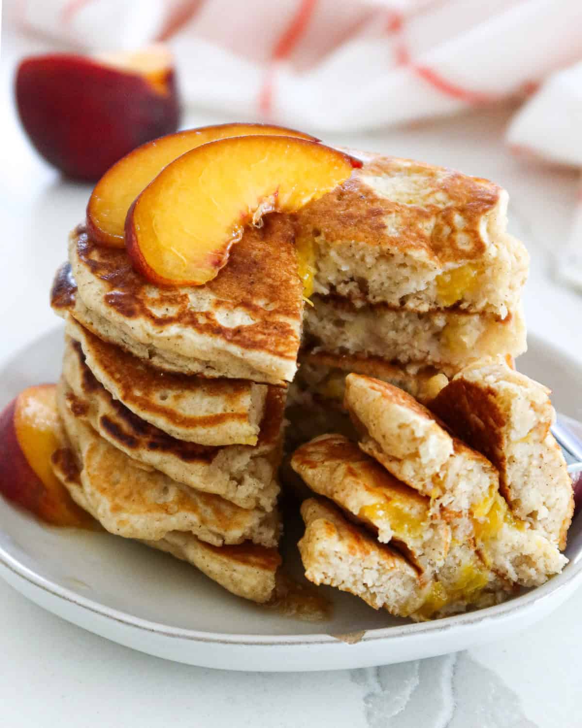 A stack of peach pancakes.
