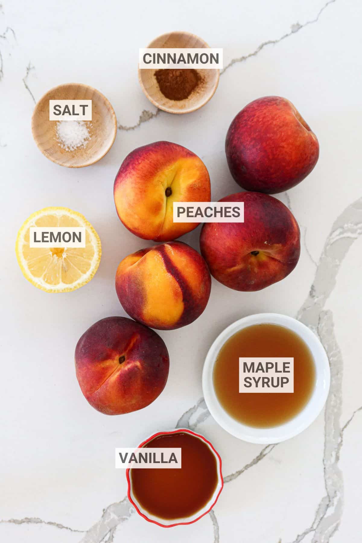 Ingredients for peach compote arranged on a white countertop with text overlay labels.
