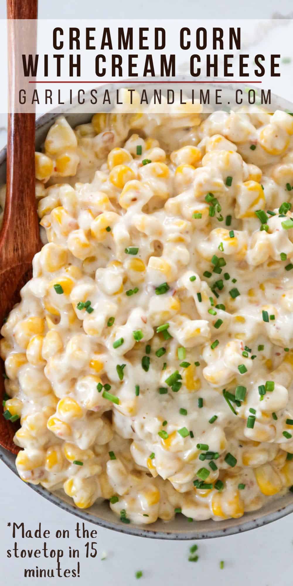 Creamed corn with cream cheese in a serving bowl with text overlay for Pinterest.