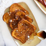 3 pieces of pumpkin french toast on a plate.