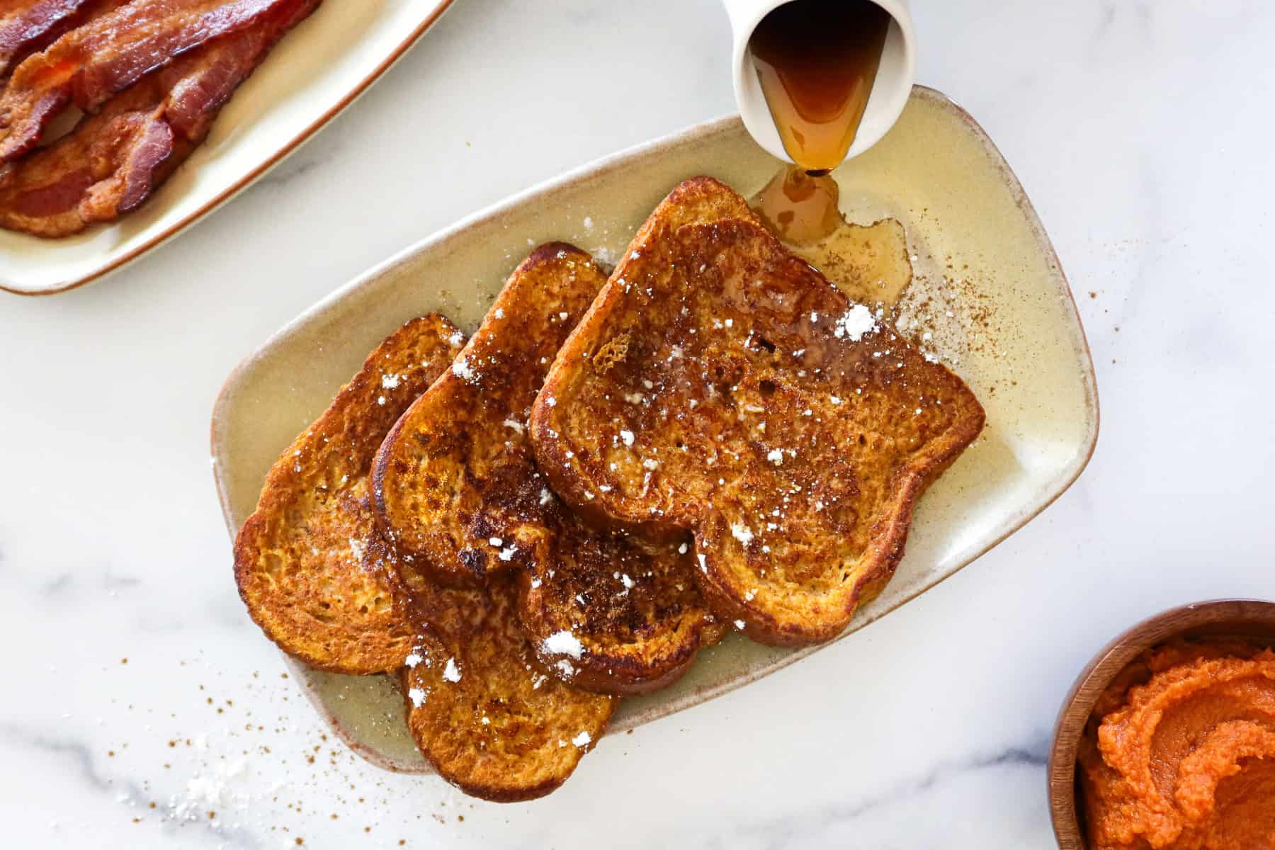 3 pieces of pumpkin french toast on a plate.