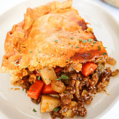 A piece of ground beef pot pie up close.