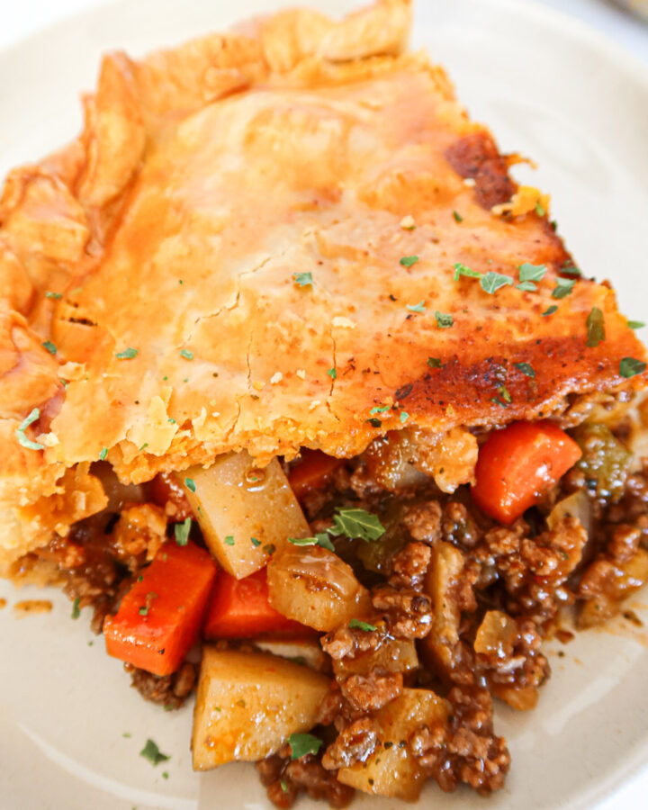 A piece of ground beef pot pie up close.