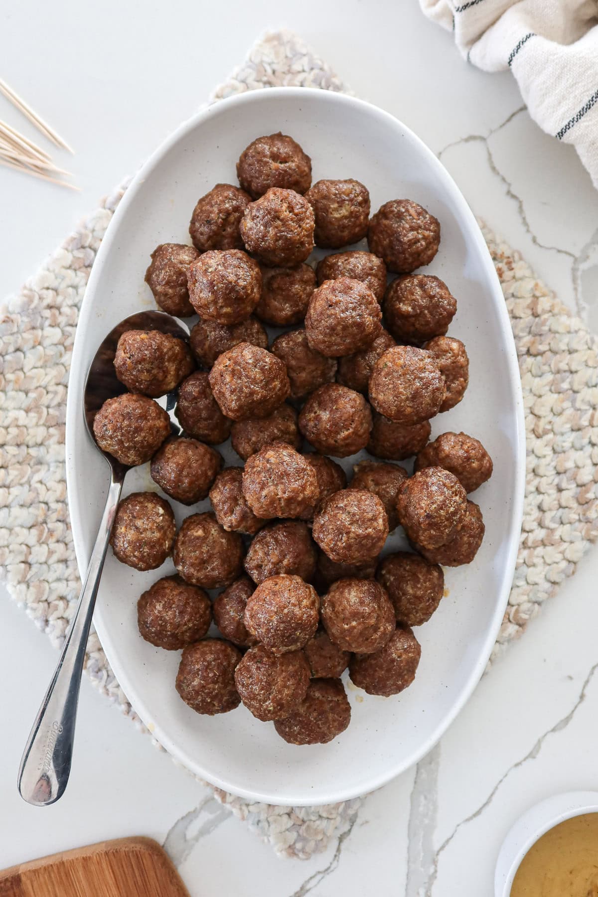 Egg free meatballs on a white serving platter.