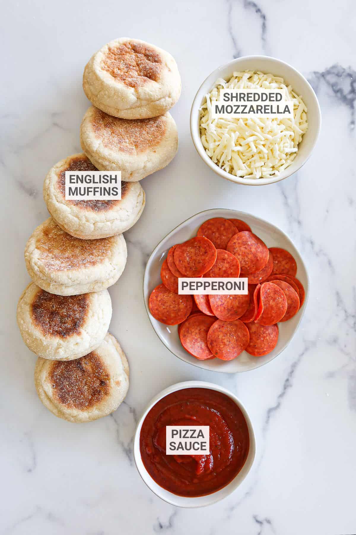 English muffin pizza ingredients with text overlay labels.