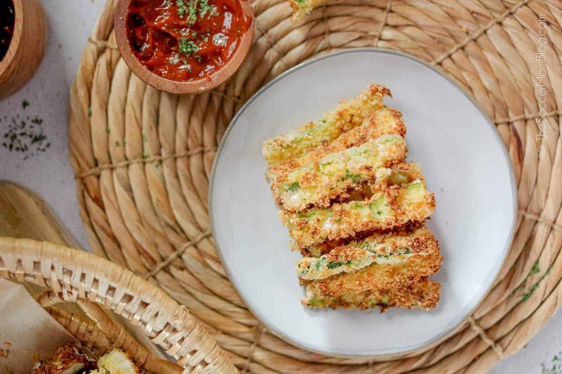 Zucchini fries on a white plate.