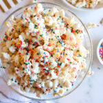 Confetti popcorn in a glass serving bowl.