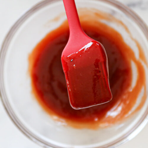 Close up of meatloaf glaze on a silicone brush.