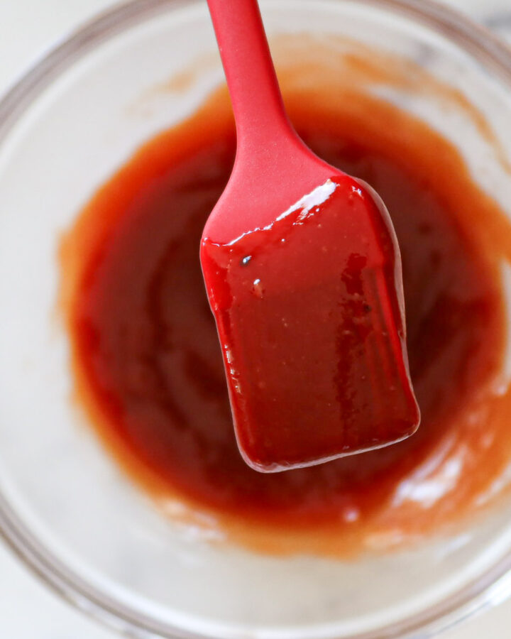 Close up of meatloaf glaze on a silicone brush.