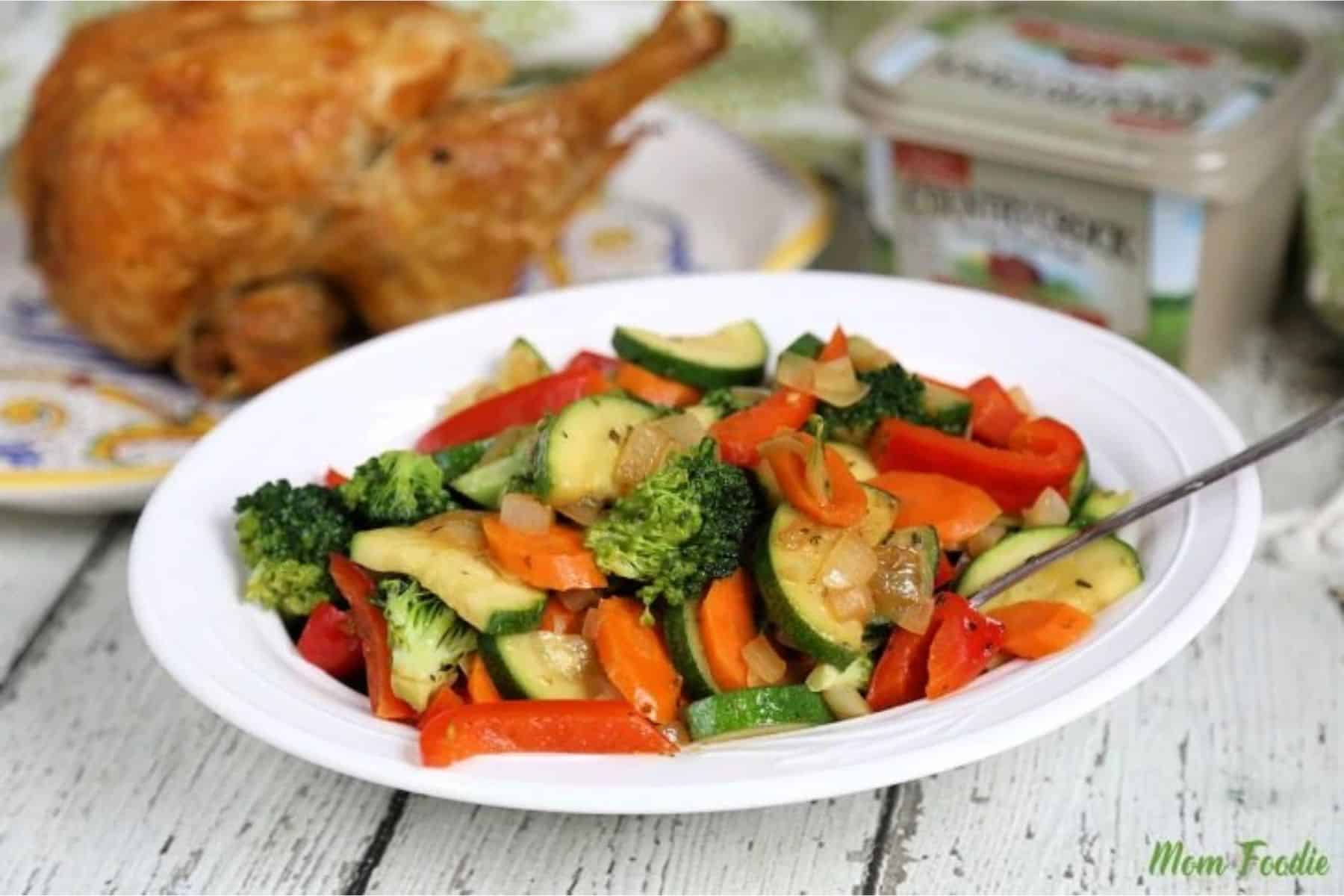 Sautéed veggies on a white serving plate.