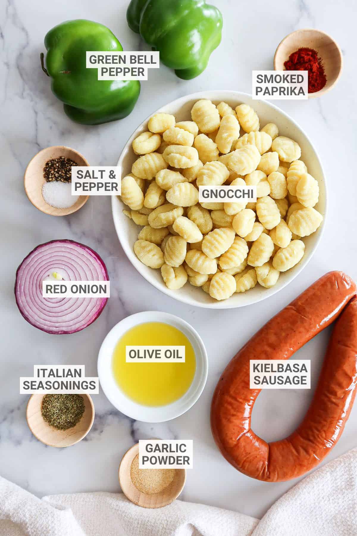 Sheet pan gnocchi and sausage ingredients with text overlay labels.